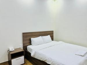 Letto o letti in una camera di Hotel Duy Dũng - Đà Lạt