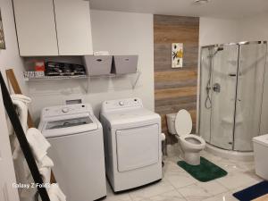 a bathroom with a stove and a shower and a toilet at Beau Séjour in Quebec City +4 photos