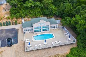 an aerial view of a house with a swimming pool at Waters Edge in Lake Ozark