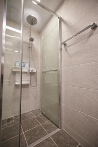 a shower with a glass door in a bathroom at Stay C Hotel Myeongdong in Seoul