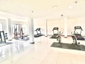 a gym with many exercise bikes in a room at Tomas Morato Quezon City - Residences in Manila