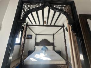 Ένα ή περισσότερα κρεβάτια σε δωμάτιο στο Maison d'hôtes Afassi