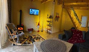 a living room with a couch and a fireplace at Iano in Oni