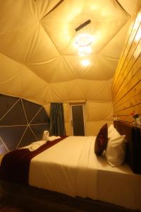 Cama o camas de una habitación en Kanal Glamp Kodaikanal Luxuries