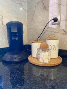 a counter top with a food processor and a cookie at Luxueux Appartement Prestigia in Marrakesh