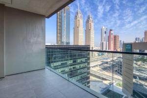 a balcony with a view of a city skyline at Sophisticated & Classy stay at The Onyx in Dubai