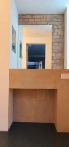 a bathroom with a sink and a mirror at Helles Zimmer im Loft in Mannheim