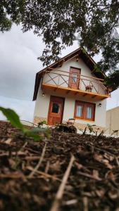 a small house on top of a hill at Pousada Vale da Neblina in Ubajara