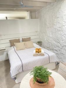 מיטה או מיטות בחדר ב-Casa Kira, Macher
