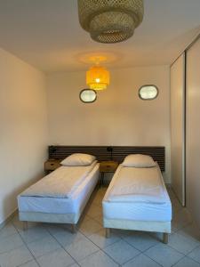 Posteľ alebo postele v izbe v ubytovaní Hôtel Particulier