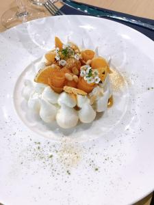 a white plate with a dessert on a table at Auberge de Mourjou in Mourjou