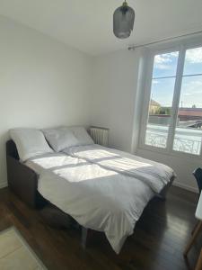 Posteľ alebo postele v izbe v ubytovaní Hôtel Particulier
