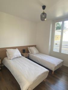 Posteľ alebo postele v izbe v ubytovaní Hôtel Particulier