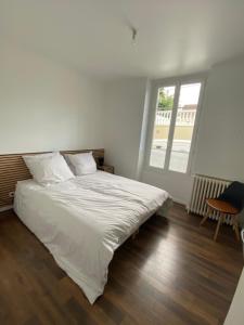 Posteľ alebo postele v izbe v ubytovaní Hôtel Particulier