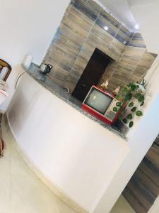 a television sitting on a counter in a room at Shipa's nubian house in Aswan