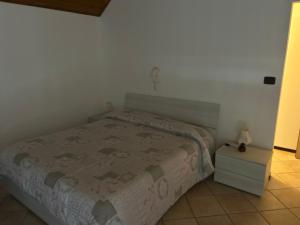 Postel nebo postele na pokoji v ubytování Albergo La Grolla