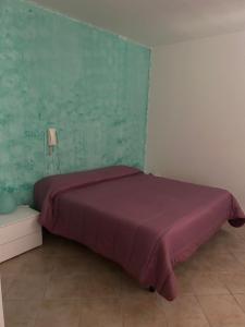 Postel nebo postele na pokoji v ubytování Albergo La Grolla