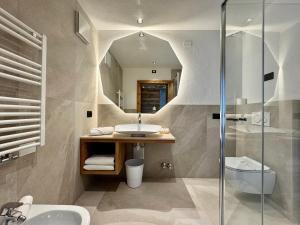 a bathroom with a sink and a shower at B&B C&egrave;sa Planber Mountain View BIKE FRIENDLY in Canazei