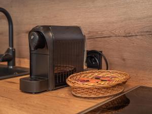 a toaster sitting on a counter next to a basket at Haus Becken in Sankt Jakob in Defereggen