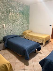 Postel nebo postele na pokoji v ubytování Albergo La Grolla
