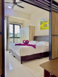 Postel nebo postele na pokoji v ubytování ATS Cameron Hotel & Apartments