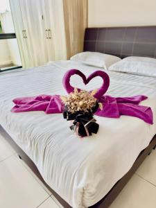 Postel nebo postele na pokoji v ubytování ATS Cameron Hotel & Apartments