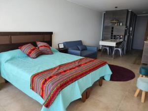 En eller flere senge i et værelse på Departamento con vista al mar + 16 billeder