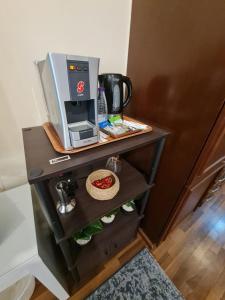 a table with a coffee machine on top of it at Studio marina 1 استديو in King Abdullah Economic City