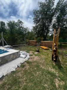 a backyard with a pool and a fence at Complejo La Rosa Molinari Cosquin in Córdoba