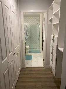 a bathroom with a walk in shower and a bathroom with a toilet at Spacious 2-bed, 2-bath condo in downtown Kelowna! in Kelowna