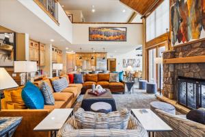 a living room with a couch and a fireplace at Trot Ski-House in Breckenridge