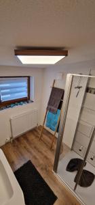 a small room with a bunk bed and a mirror at Appartement Gletscher-Koje in Tux