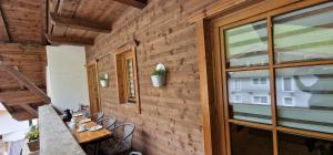 a room with a table and chairs and a window at Appartement Gletscher-Koje in Tux