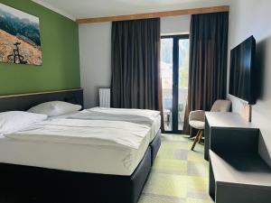 Cama ou camas em um quarto em Hotel Simader
