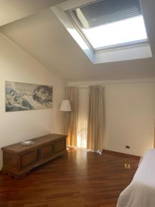a bedroom with a bed and a skylight at CIVICO 16 in Chiaravalle
