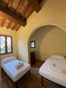 Postel nebo postele na pokoji v ubytování Casa vacanze Le due torri