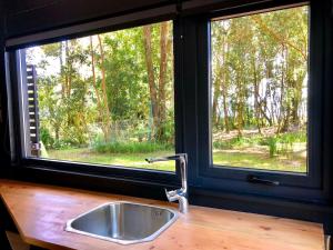 Zahrada ubytování Calma Cabins