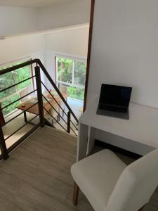 a laptop computer sitting on a desk in a room at Playa Hermosa, Mistico, Surf, Bike, Hike, 4 Hab, Lagos, Familia in Jacó