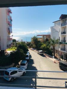 a street with cars parked in a parking lot at Begumhan Pansiyon in Antalya