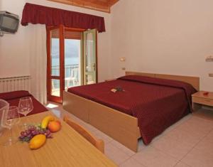Postel nebo postele na pokoji v ubytování Hotel Augusta Garnì + 37 fotografií