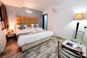 Postel nebo postele na pokoji v ubytování Hotel Clink New Delhi Airport
