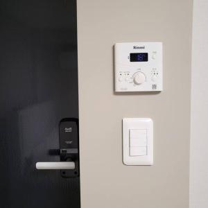 a picture of a remote control on a wall at ArinHouse in Seoul