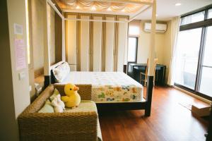 Postel nebo postele na pokoji v ubytování 宜人生活溜滑梯親子民宿 Easylife B&B