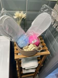 a basket on a shelf in a bathroom with towels at Gökler Çiftliğinde Ekolojik Tatil in Foca