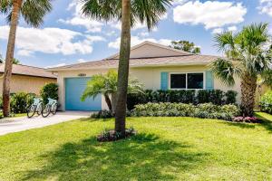 a house with palm trees and a garage at Naples Beach Retreat Bike to Beach! 4 Bed 2 Bath in Naples