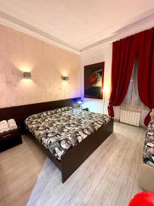 a bedroom with a bed and red curtains at Chroma Italy - Chroma Tessera in Rome