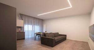 a living room with a couch and a table at Casa Vacanza Rimini in Rimini