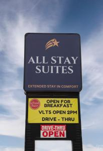 un panneau indiquant un sous-sol toutes étoiles dans l'établissement All Stay Suites, à Westlock