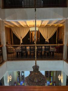 a chandelier hanging from the ceiling in a room at Vue imprenable à Essaouira in Diabat