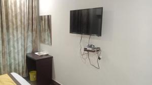a flat screen tv hanging on a wall at Hotel Imperial Inn in Ajmer
